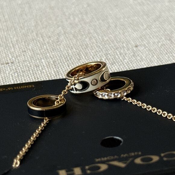 Coach Multi-Ring Pendant Necklace Gold Cream Black Enamel Crystal NWT 16”+2” - Picture 6 of 10